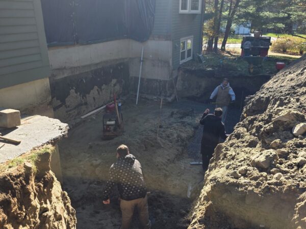 Excavating for the home addition foundation in Westford, MA Excavating for the home addition foundation in Westford, MA