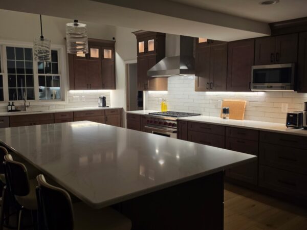 Finished kitchen with a large island and under-cabinet lighting in Westford, MA Finished kitchen with a large island and under-cabinet lighting in Westford, MA